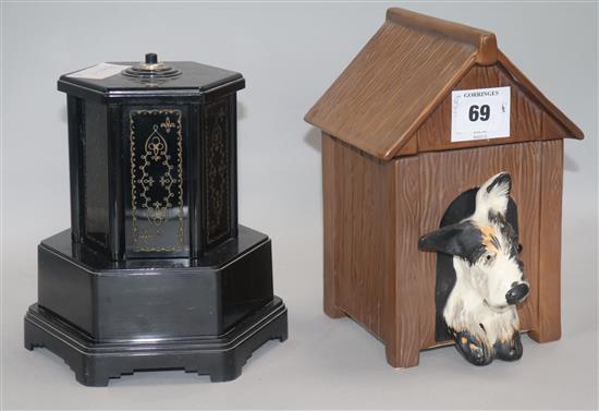 A bakelite musical cigarette dispenser and a similar pottery kennel